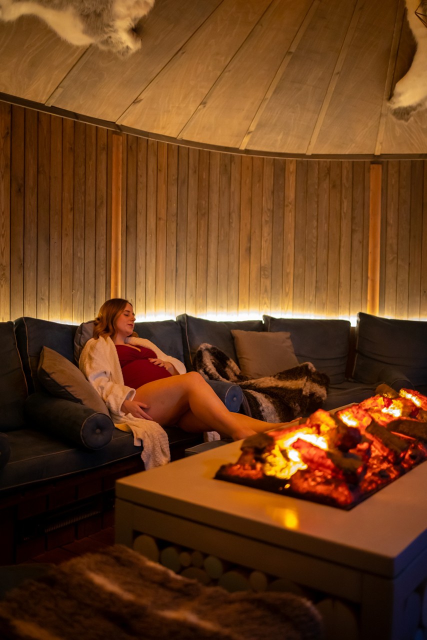 Woman relaxing inside the Scandinavian Snug.